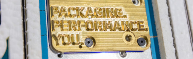 Embossing die with Packaging Performance You lettering in corrugated cutting-die | © Marbach Group