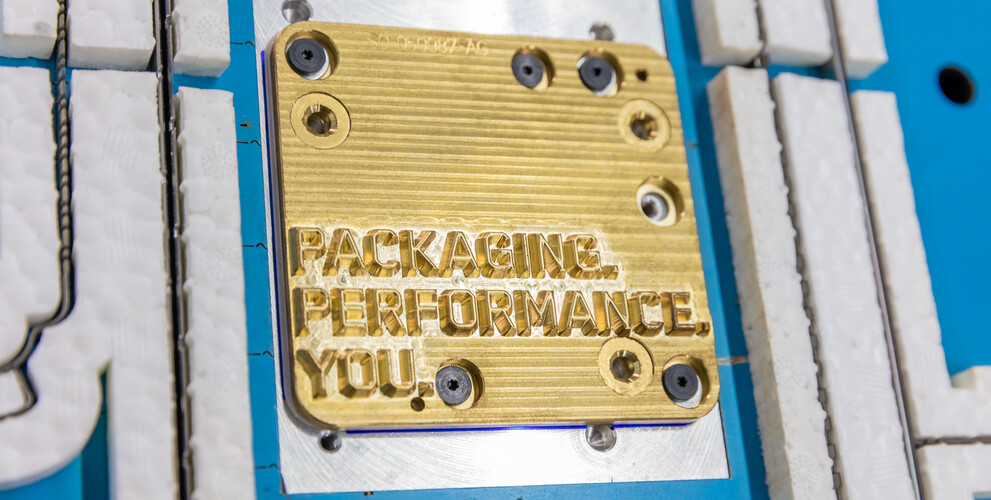 Embossing die with Packaging Performance You lettering in corrugated cutting-die | © Marbach Group