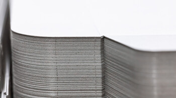Stack of die-cut blanks with nicks | © Marbach Group