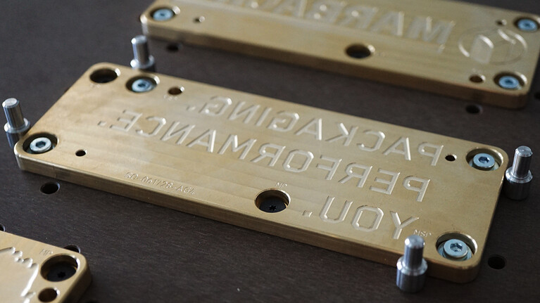 Embossing register system for embossing dies. 